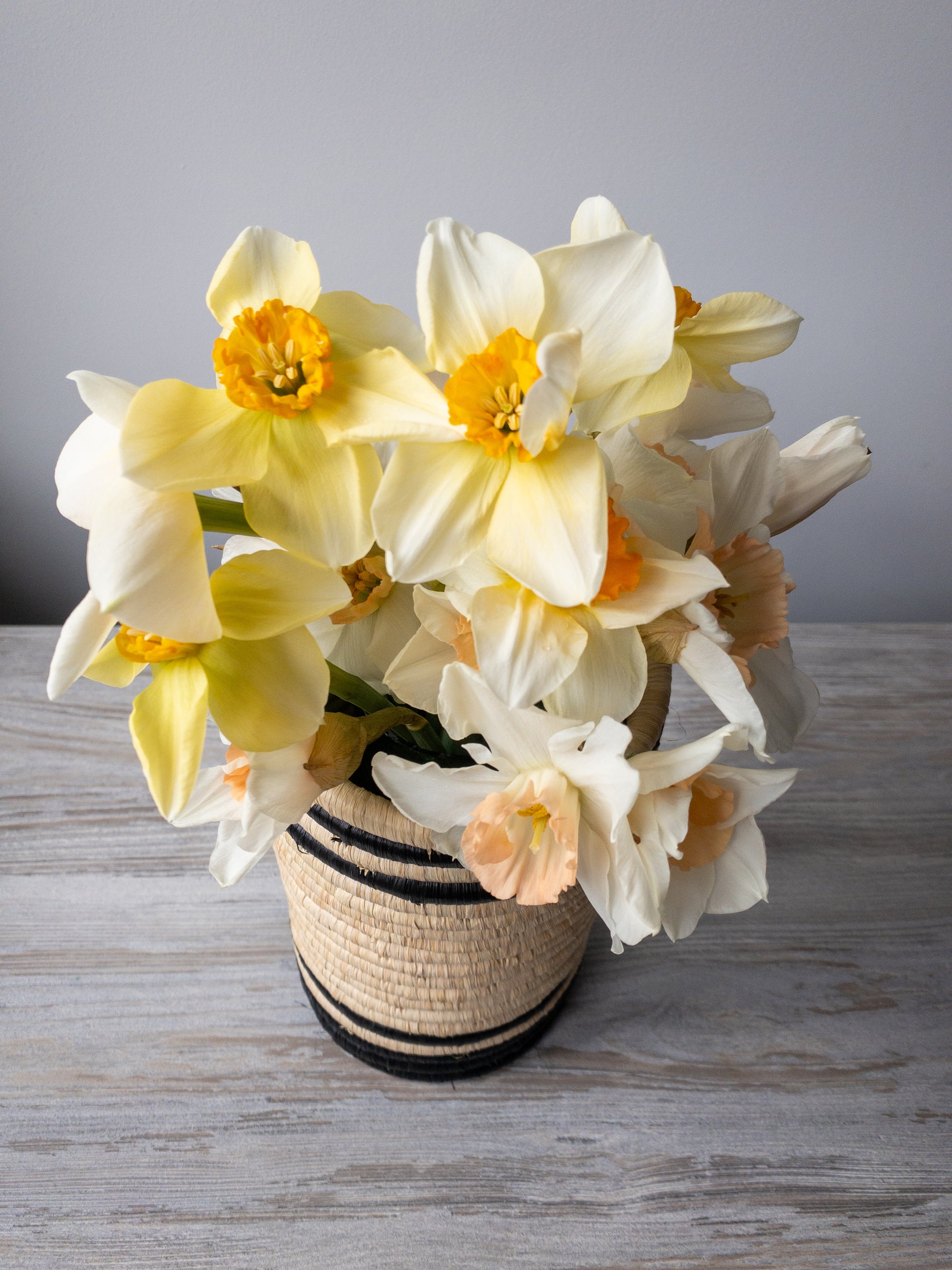 woven african vase with spring flowers