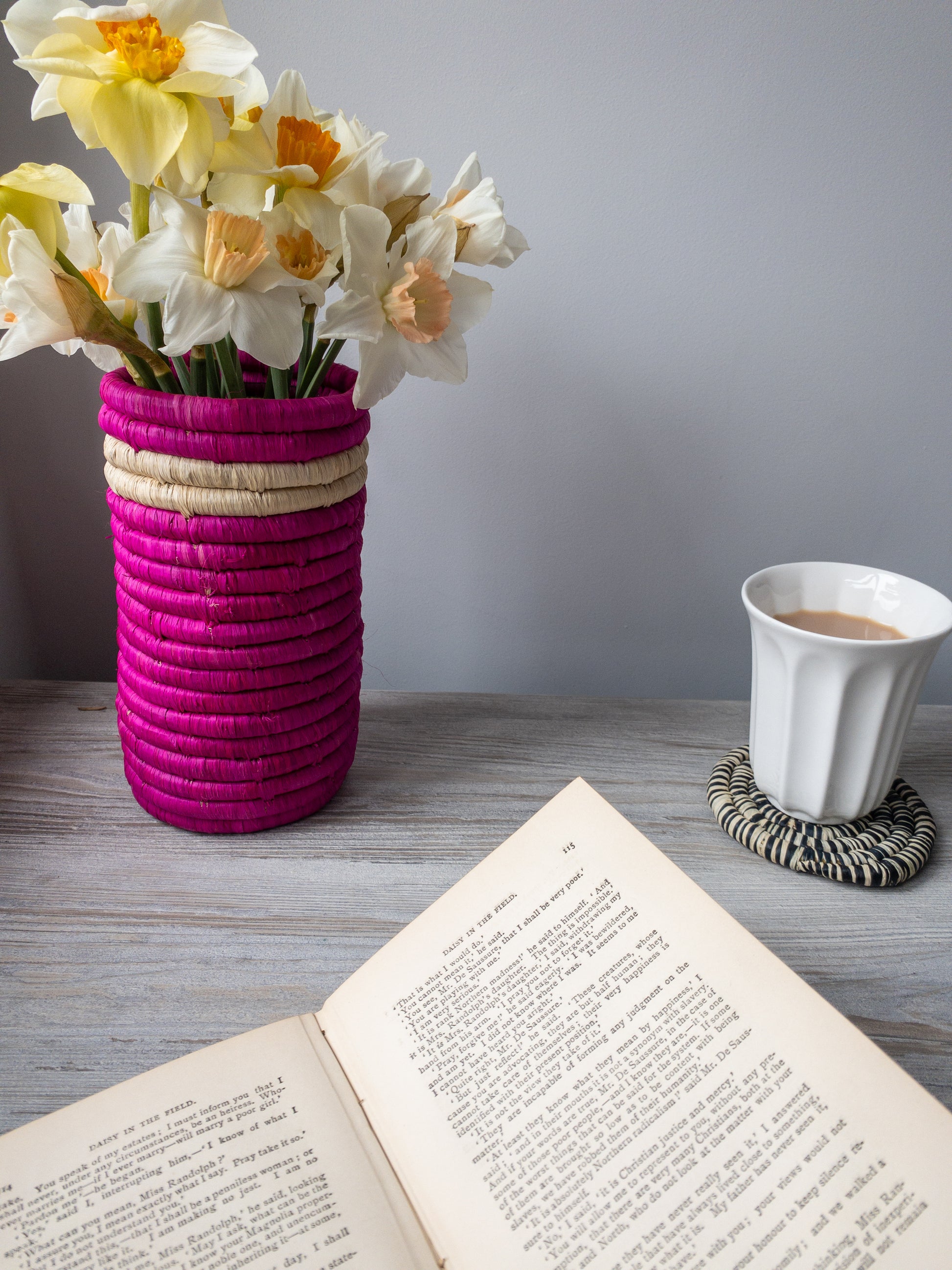 african pink vase with book and tea